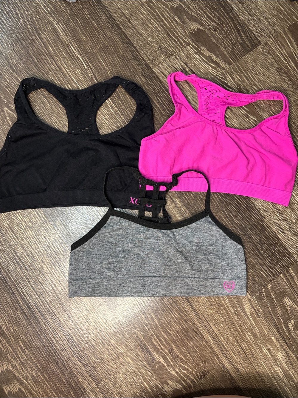 A set of 3 large girls sports bras